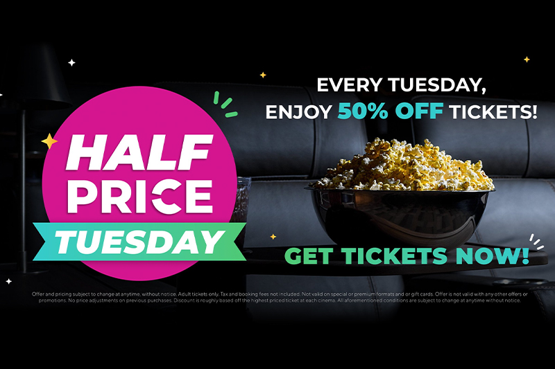 Promotional image for a movie theater featuring "HALF PRICE TUESDAY" in bold, colorful letters with a bright pink and green design. Text above reads "EVERY TUESDAY, ENJOY 50% OFF TICKETS!" and below is a call to action saying "GET TICKETS NOW!" against a background with a large bowl of popcorn on a dark couch, symbolizing a movie-going experience. Small print details the offer's terms and conditions.